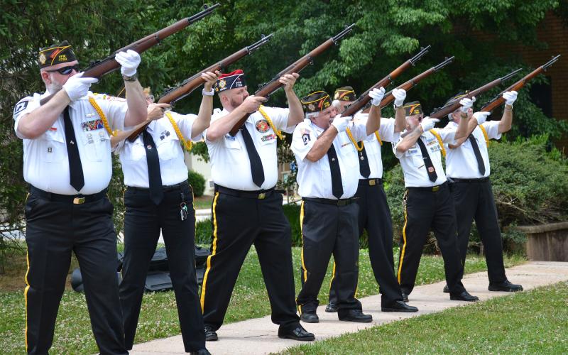 Grant-Reeves Honor Guard (from left) Dana McCloud, Connie Barrow, Michael Dale, Stan Charette, Barry Church, Robert Trousdale and Ken Sheridan fire to honor the memory of those lost in battle. BRIAN WELLMEIER/Staff