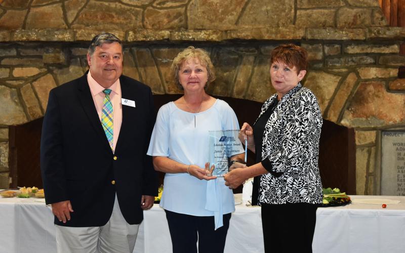 Georgia Municipal Association Member Services Consultant Stan Brown, left, and Director of Members Services Pam Helton, right, congratulate Cornelia City Clerk Janie Henderson, middle, for receiving the Lifetime Achievement Award. CHAMIAN CRUZ/Staff