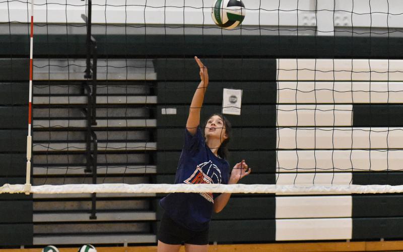 Rebecca Heyl works on getting spin on a serve. ISAIAH SMITH/Staff