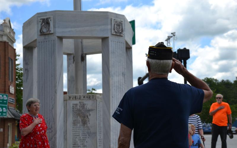 Ray Durham salutes the KIA Memorial in Clarkesville along with Sandra White (left). BRIAN WELLMEIER/Staff