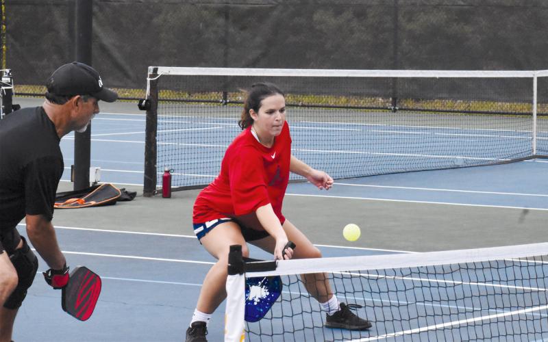 Sydney Krause plays a ball during a recent pickleball outing in Clarkesville. The pickleballers share the courts with tennis players.