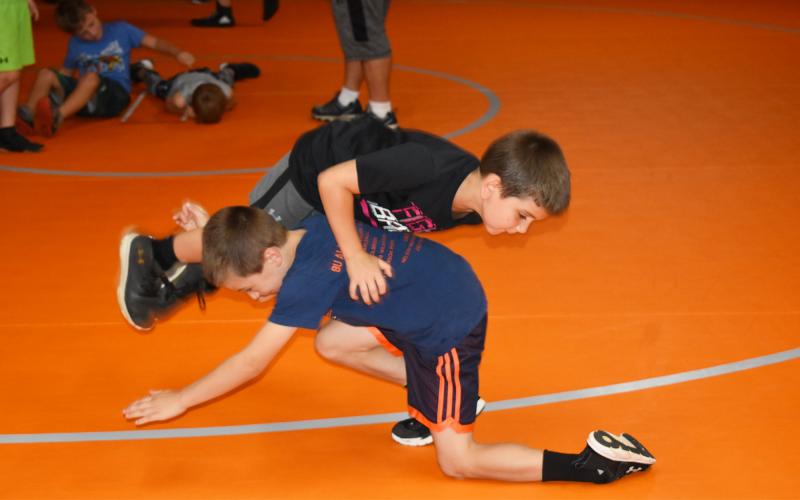 Jacob Wilkinson tries to get underneath Walyan Daw during Raider wrestling camp. MATTHEW OSBORNE/Staff
