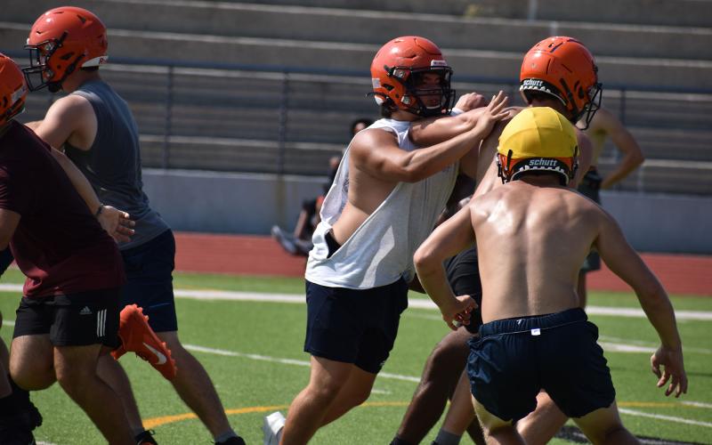 Raiders get their blocking work in before putting on pads early next month. MATTHEW OSBORNE/Staff