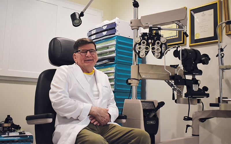 Longtime optometrist Dr. John Hendrix of Demorest is calling it a career after his 70th birthday next week. He has practiced for 43 years. MATTHEW OSBORNE/Staff