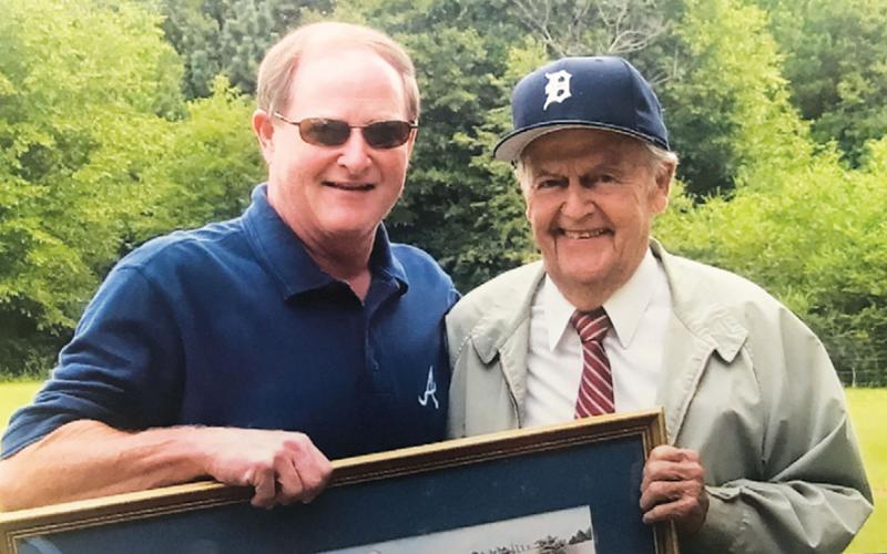 Ronnie Parham of Cornelia (left) has a Ty Cobb mural framed and signed by Cobb’s former batboy, Jimmy Lanier (right). PAT PARHAM/Submitted