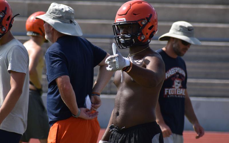 Simarcus Burney gives the thumbs up to a  teammate before lining up for a drill. MATTHEW OSBORNE/Staff
