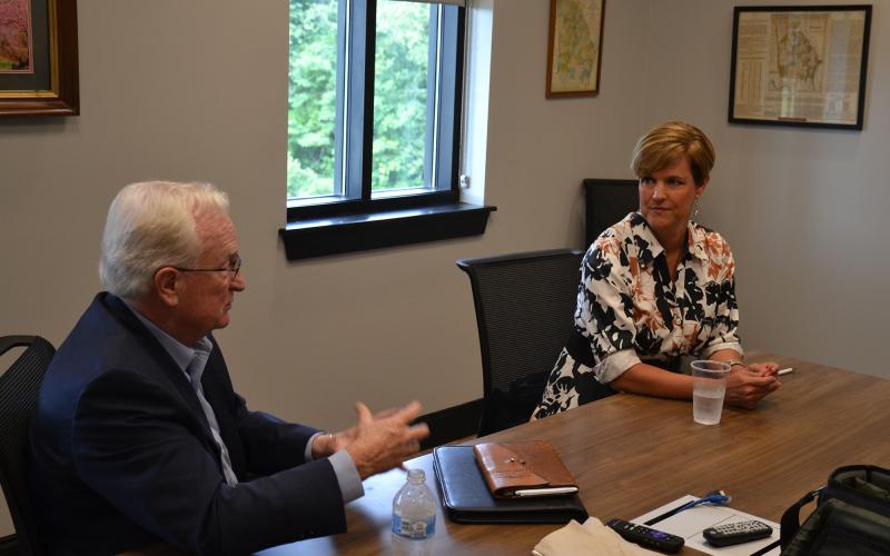 Habersham County Manager Phil Sutton talks with his replacement Alicia Vaughn on Monday morning. Vaughn will take over as interim manager for at least the next four months. MATTHEW OSBORNE/Staff