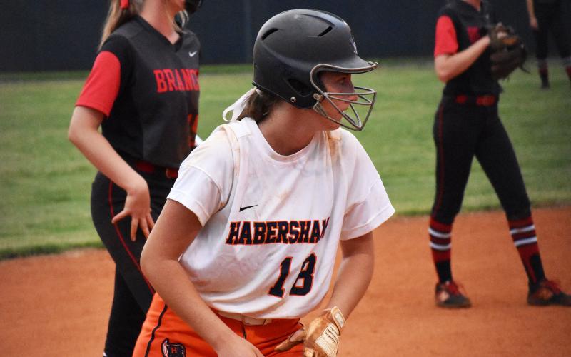 Habersham Central’s Taylor Wade looks for a chance to sprint home from third during a game against Flowery Branch last season. MATTHEW OSBORNE/Staff
