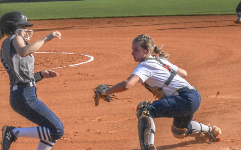 Taylor Wade tags out a White County player trying to score after receiving a great throw from center fielder Hailey Wade. CODY ROGERS/Staff