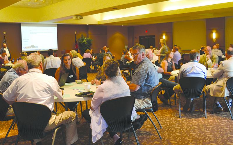 Residents gathered at Habersham EMC headquarters Tuesday morning to share their input on economic development. BRIAN WELLMEIER/Staff