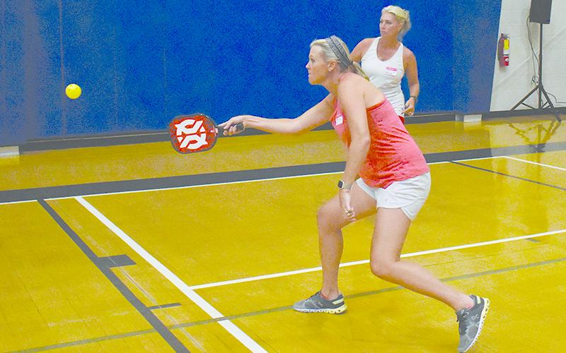 Alyson Paul (front) and Myrna Owen-Olsson compete in the Round Robin pickleball fundraiser at Ruby Fulbright Aquatics Center.