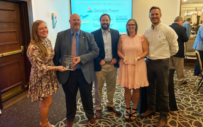 Cornelia representatives (from left) Emily Herrin, Donald Anderson, John Borrow, Jessie Owensby and Heath Barrett celebrate the city’s awards at the Georgia Downtown Association (GDA) Conference. CHARLIE FIVEASH/Submitted