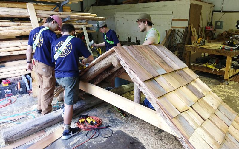 McGahee and his fellow Scouts work on the roof structure for the historic marker. JAKE MCGAHEE/Submitted