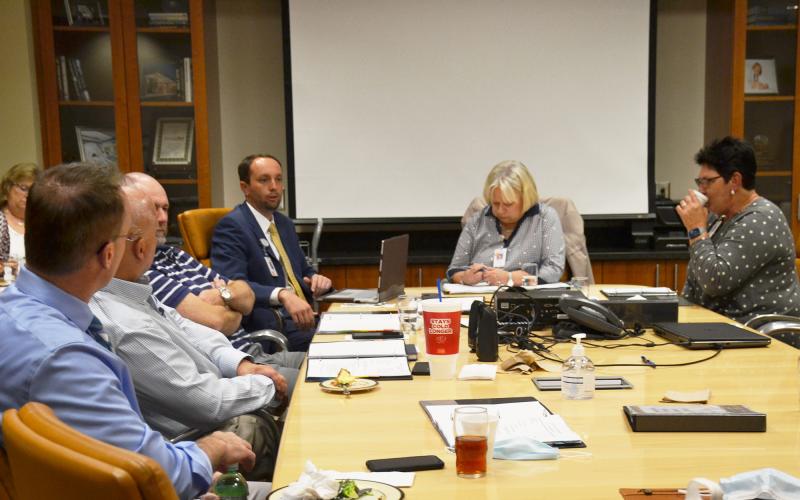 Habersham County Hospital Authority members talk things over with CEO Tyler Williams at Tuesday’s meeting. BRIAN WELLMEIER/Staff