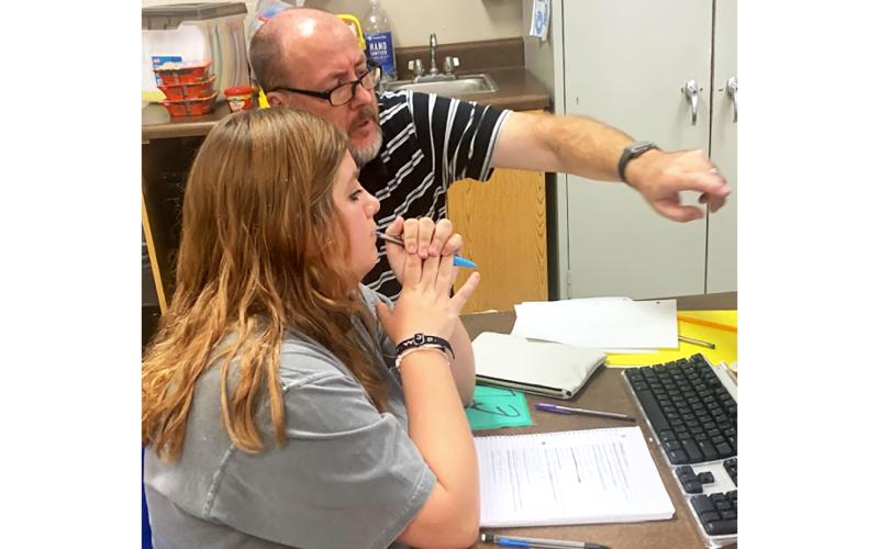 Teacher Karl Mealor works directly with student Karah Hicks at Mountain Education Charter High School’s Habersham County site. JENNIFER GLOVER/Submitted