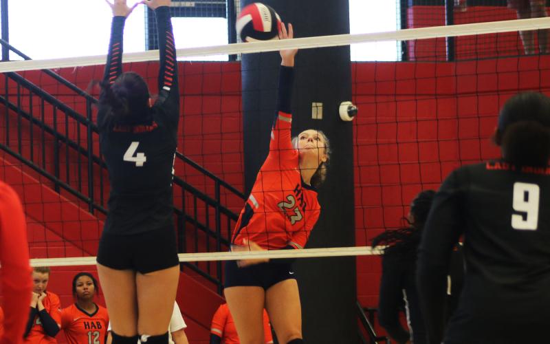Habersham Central’s Emma Murray goes hard to the net against a Stephens County blocker during Tuesday’s match. MARCUS ETIENNE/CNI News Service