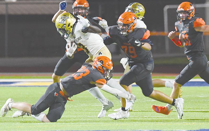 Habersham Central’s Carter Barrett (23) and B.J. Hodges (79) bring down a runner during the win over Apalachee. TOM ASKEW/Special