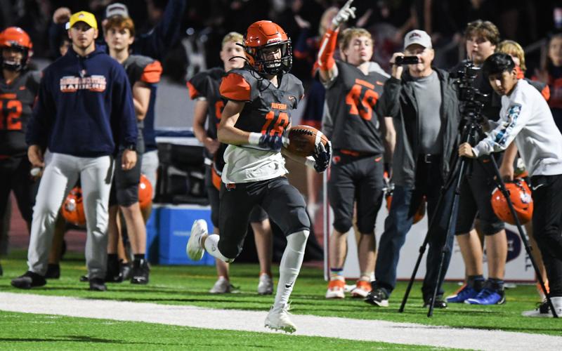 Habersham Central’s Slade Dover heads to the house with a pick-six during Friday’s game against Winder-Barrow. TOM ASKEW/Special