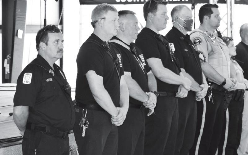First responders (from left) Kevin Sprinkle, Clarkesville Assistant Fire Chief; Shawn McClure, Jeff Parker and Mark Gerrin of Habersham County Emergency Services; Michael Cragg of the Baldwin Fire Department; and Zack Martin and Connie Dukes of the Habersham County Sheriff’s Office were recognized at the 9/11 event Saturday at the Chattahoochee Mountain Fair. MATTHEW OSBORNE/Staff