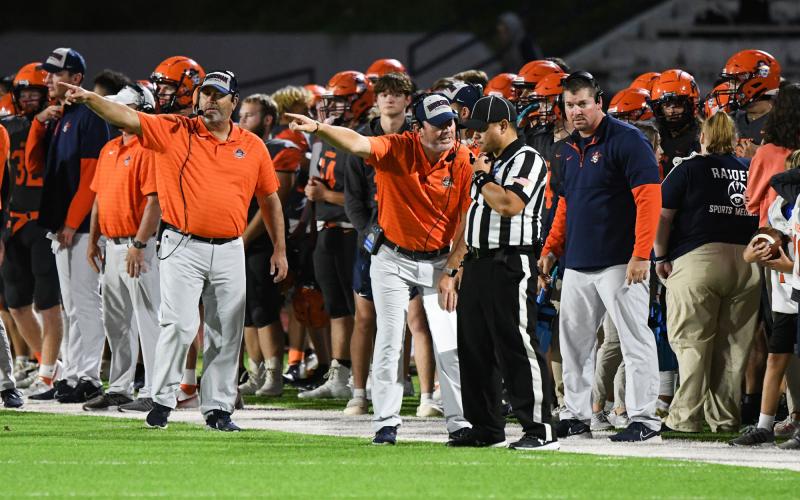 Habersham Central coach Benji Harrison points out a possible discrepancy with the official during Friday night’s game against Winder-Barrow. TOM ASKEW/Special