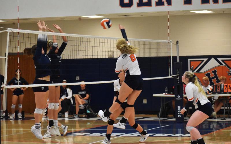 Habersham Central’s Landrey Pike goes for the kill at the net against West Hall on Thursday night. CODY ROGERS/Staff