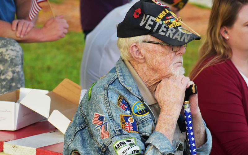 Korean War veteran Capt. Bill Morgan listens intently to the presentation at the Wall of Honor on Saturday. MATTHEW OSBORNE/Staff