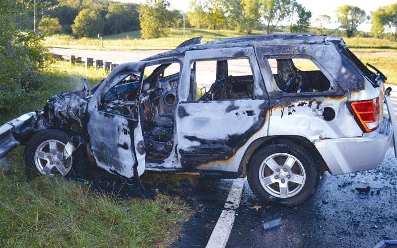 This Jeep Grand Cherokee burned after it caught on fire following a crash with a Habersham County Transit van on Thursday morning. MATTHEW OSBORNE/Staff