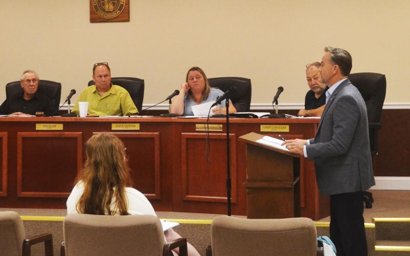 Fletcher Holliday of EMI speaks to the Baldwin Council on Wednesday night. BRIAN WELLMEIER/Staff