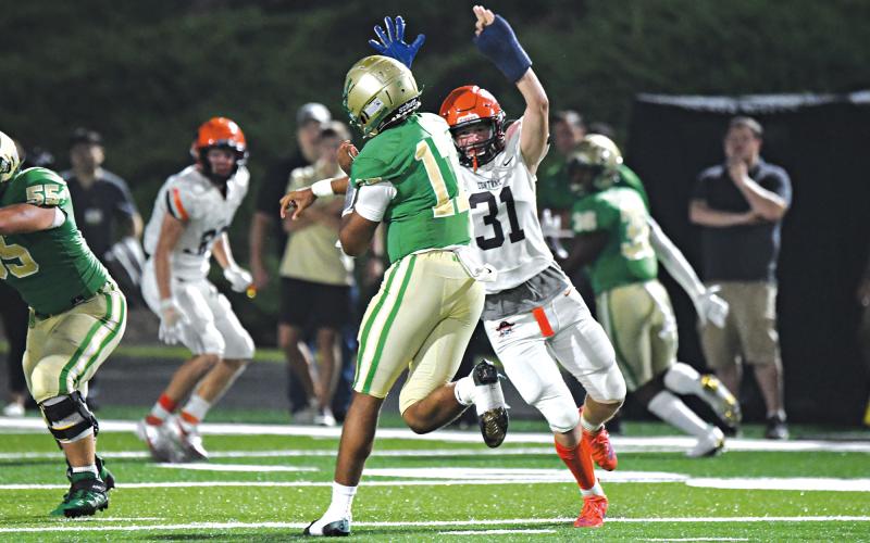 Habersham Central’s Braydon Wright looks to disrupt Buford’s quarterback during last Friday’s game. TOM ASKEW/Special