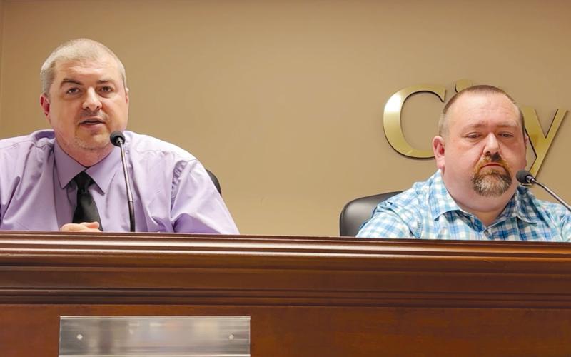 Shawn Allen (left) speaks at Thursday’s Demorest forum as opponent Roy Ferguson listens. MATTHEW OSBORNE/Staff