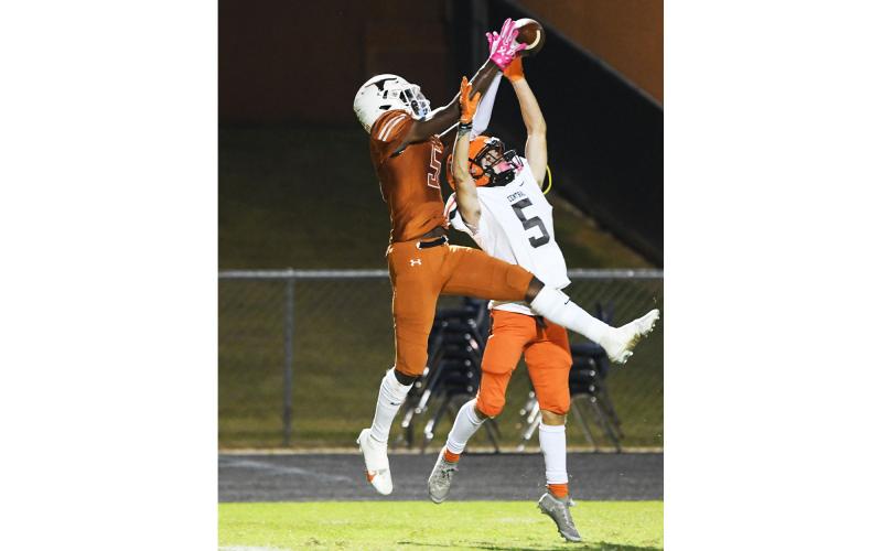 Lanier’s Tywan Royal breaks up a pass intended for Habersham Central’s Zeke Whittington last Friday. TOM ASKEW/Staff