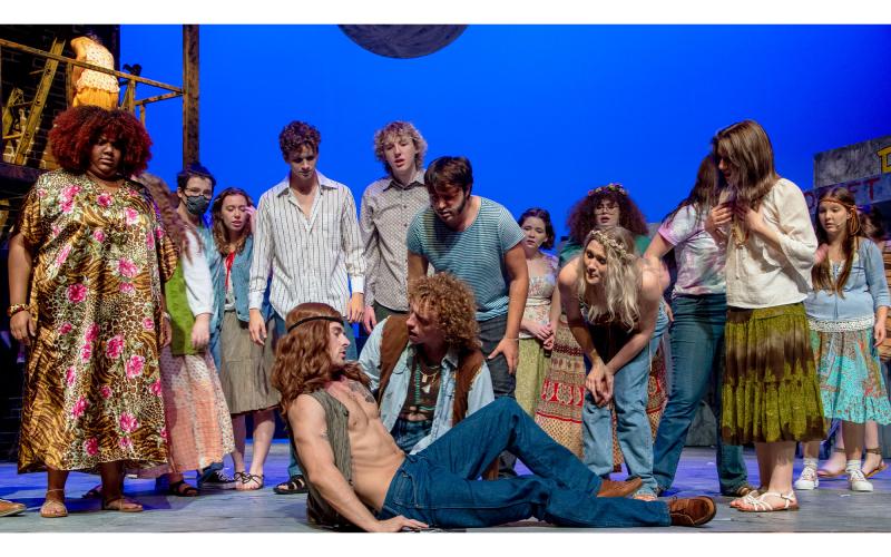 Berger (Garrett Smith) comforts his friend Claude (Jordan Hicks) after Claude suffers from hallucinations, in Piedmont University’s production of the musical “Hair.” KIMBERLY BROWN/Submitted