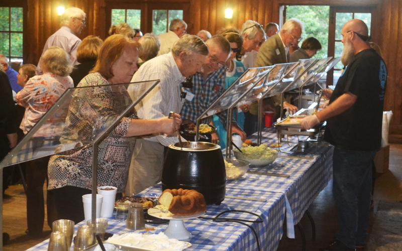 Members of the Habersham Central Class of 1971 shared a barbecue meal at their 50th reunion Saturday night at the Cornelia Community House. MATTHEW OSBORNE/Staff