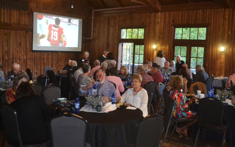 Habersham Central had 70 class members signed up for the 50th reunion of its first graduating class. The organizers made sure they could keep an eye on the Georgia game while catching up with old friends. MATTHEW OSBORNE/Staff