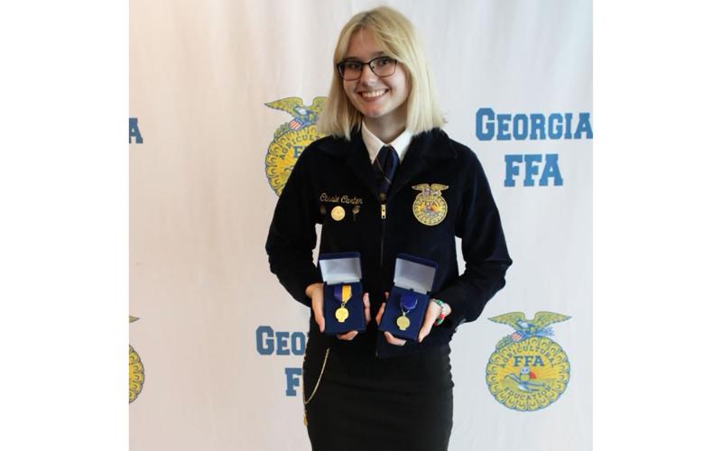 Cassie shows off  her medals won at the national FFA convention. CASSIE CARTER/ Submitted