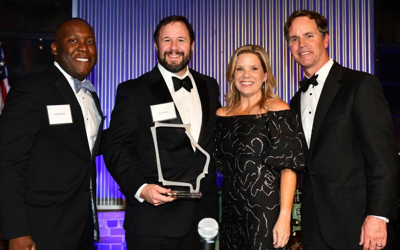 Cornelia Mayor John Borrow collects the E. Dale Threadgill Community Service Award along with Leadership Georgia trustee Jerald Mitchell (left), Chair Jennifer Evans and President Charles May Jr. SUBMITTED
