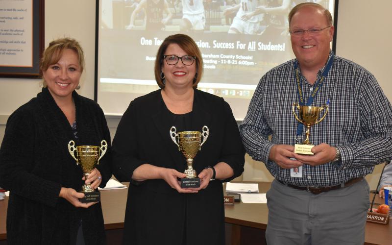 Staff attendance leaders for October were (from left) Principal Lana Jones of Woodville Elementary (top elementary), Franklin of the Ninth Grade Academy (top secondary) and Principal Rodney Long of Baldwin Elementary (most improved). MATTHEW OSBORNE/Staff