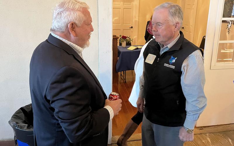 Mt. Airy Mayor Gary Morris (left) converses with former Georgia Sen. John Wilkinson, who is now president of North Georgia Technical College, at his farewell reception Friday. MATTHEW OSBORNE/Staff
