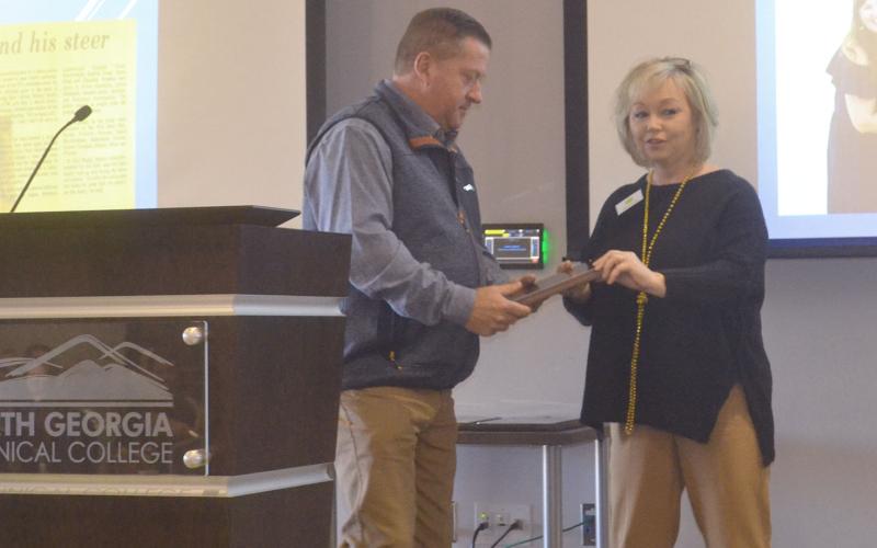 Todd Harper receives the Habersham County Friend of Agriculture award at Friday’s breakfast event from Barbara Rhodes, Habersham Chamber ambassador. BRIAN WELLMEIER/Staff