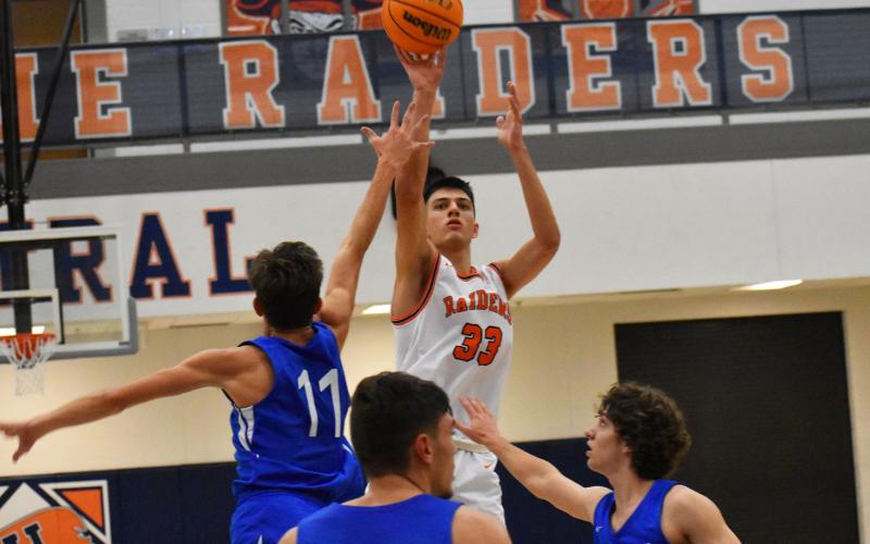 Habersham Central’s Mekhi Mawdesley shoots over three Banks County defenders during Friday’s win over Banks County. Mawdesley had 36 points in his home debut. CODY ROGERS/Staff