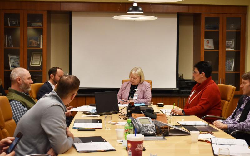 From left: Hospital Authority Board Members Tyler Williams, CEO, Habersham Medical Center, Josh Garrett, Hospital Board Authority Member, Andy Anderson, Hospital Board Authority Member, Dollie Ritchie, Chair, Hospital Board Authority, Teri Newsome, Hospital Board Authority Member, Ken Johnson, Hospital Board Authority Member discuss business during a Tuesday evening meeting. BRIAN WELLMEIER/Staff