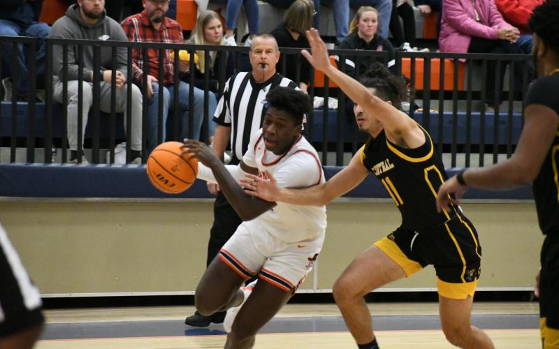 Bryce Pittman drives to the hoop on Friday night.