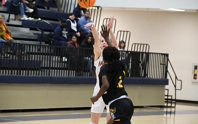 Habersham Central's Kelsey Banks puts up a 3-pointer with a Central Gwinnett defender right on her Friday night. MATTHEW OSBORNE/Staff