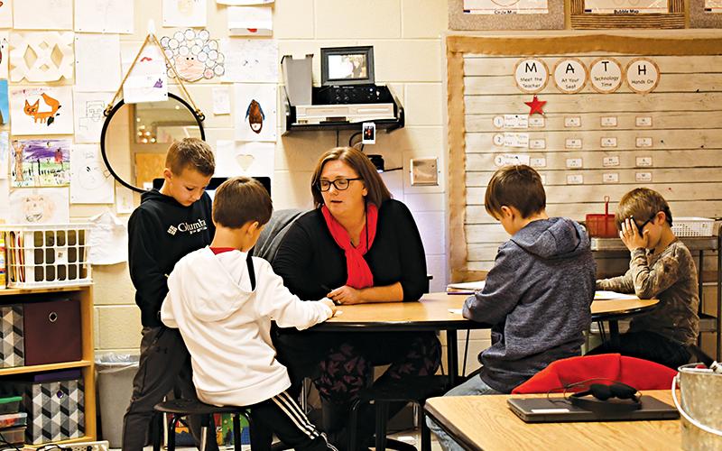 Elissa Hipps works with second graders at Fairview Elementary on Thursday afternoon. Students returned to classes on Wednesday. BRIAN WELLMEIER/Staff