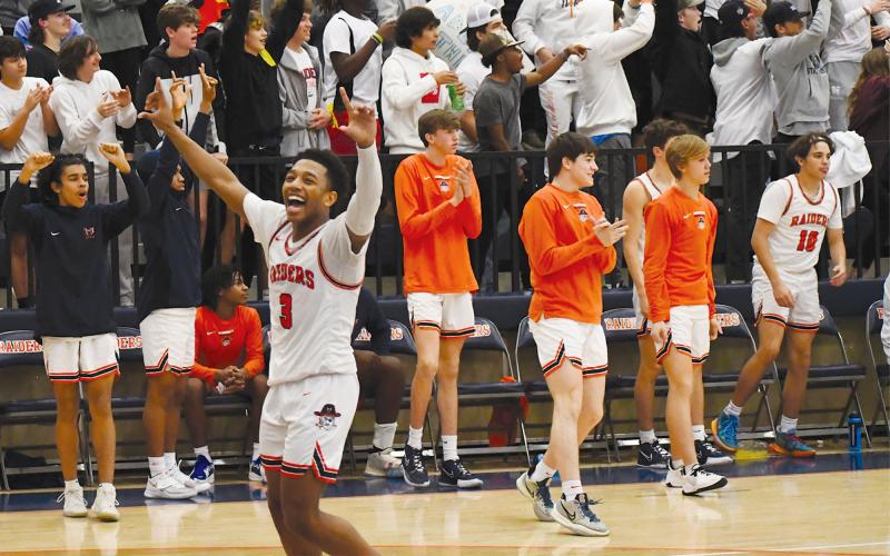 Malachi Dooley celebrates the Raiders’ big region win over Dacula. CODY ROGERS/Staff
