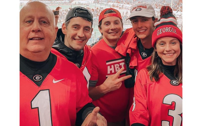 Habersham County residents Sidney Roland, Lanier Roland, Wyatt Burgess, Cooper Roland and Millie Burgess celebrate Georgia’s first national championship since 1980 after making the trip to Indianapolis to see the Bulldogs beat Alabama on Monday night. SIDNEY ROLAND/Submitted
