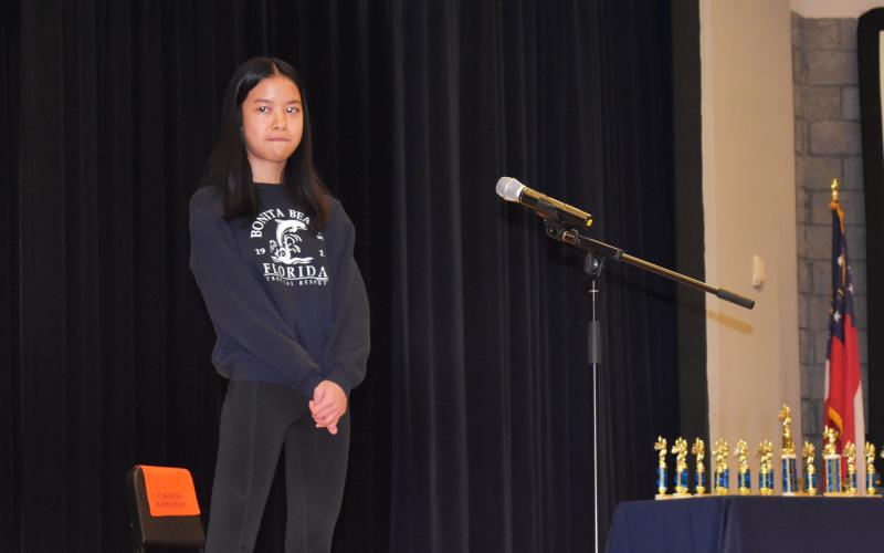 Kayla Nifong of South Habersham Middle School ponders a word during Wednesday morning’s spelling bee. AMARIS E. RODRIGUEZ/Staff
