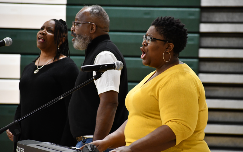 The Burns family – Vanessa, Ernest and Portia (from left) – sing at Tallulah Falls School on Friday morning as part of a Black History Month presentation. MATTHEW OSBORNE/Staff