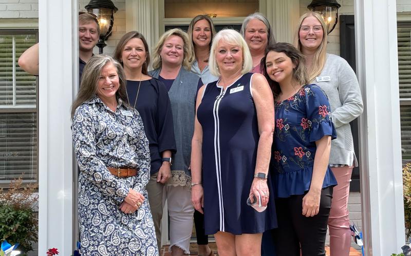 (front row, from left) Leigh Johnston, Chairperson, Board of Directors; Linda Johnson, Executive Director and Rebecca Glaze, Director of Operations. Middle row are (from left) Suzanne Dow, Board Member (also Executive Director of Circle of Hope) and Lisa Nicholson, Board Member. Back row are (from left) Justin McKinney, Master’s Level Intern;  Candice Holcomb, Board Member (also Executive Director of Habersham United Way) Melanie Allen, Family Resource Center Employee and Aly Johnson.
