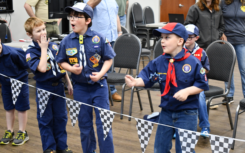 Gabriel Torrance of Pack 68 in Toccoa (middle) celebrates with packmate Chase Andrews (left) and Kallum  Liversage of Pack 5 in Clarkesville after one of the heats at the Currahee District Pinewood Derby held Saturday in Clarkesville.